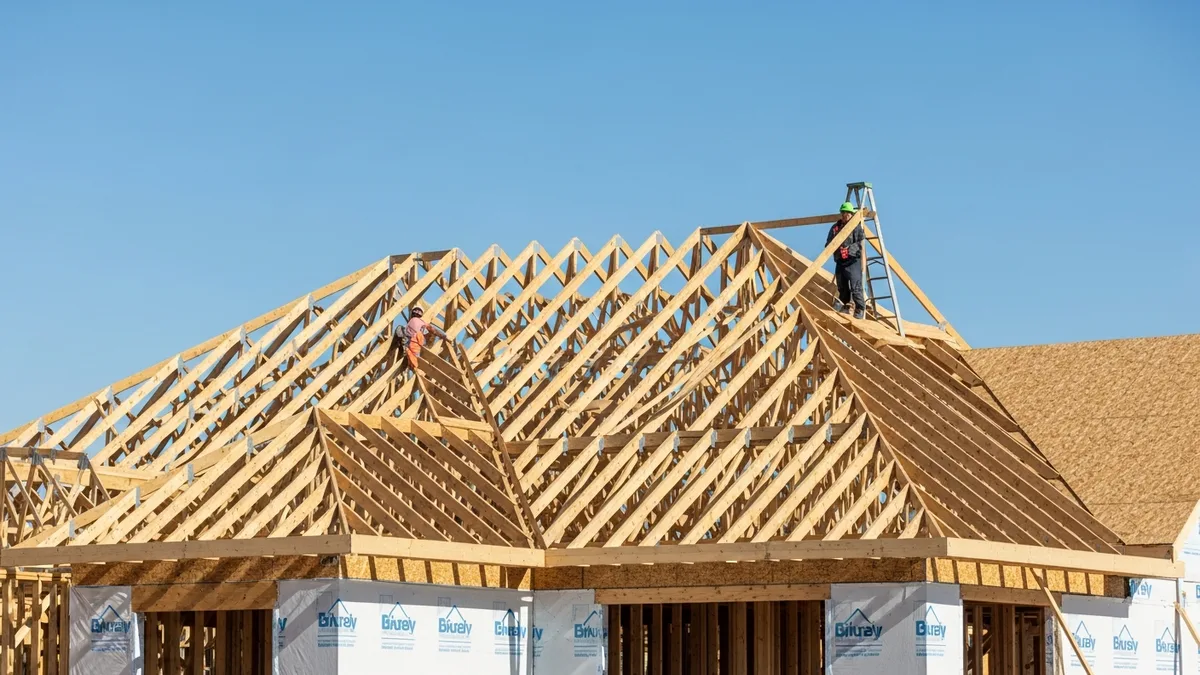 Exterior sheathing and weather barrier installation on a residential construction project