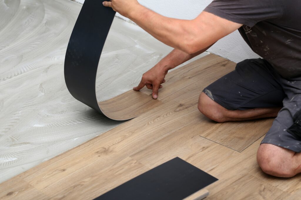 Contractor installing flooring.