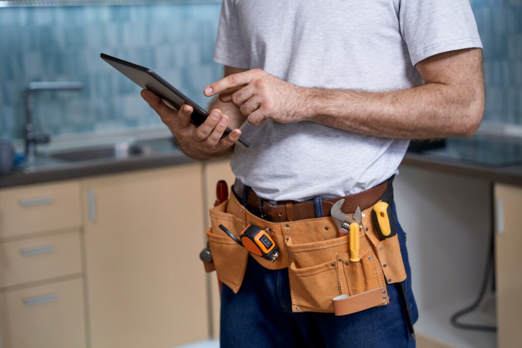 Contractor using a tablet on the job site.