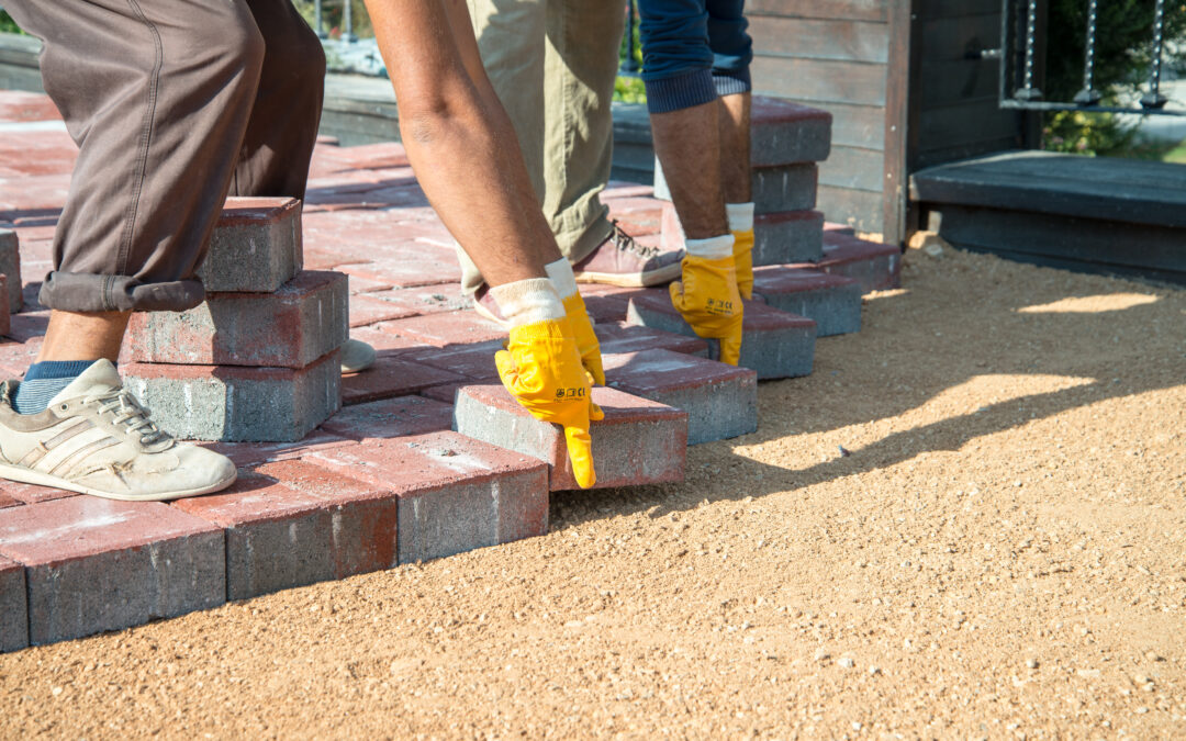 Contractors setting brick tiles