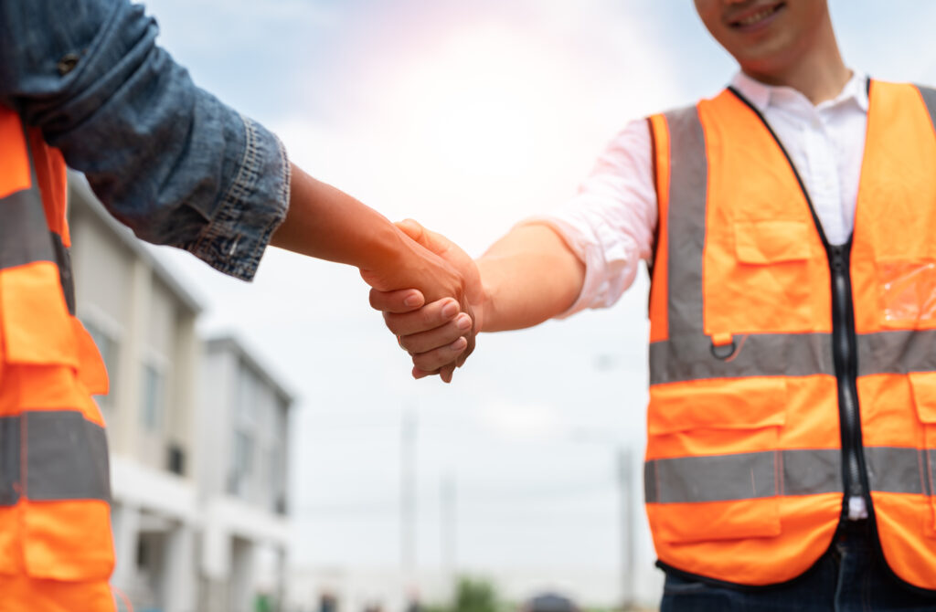 Contractor handshaking a client
