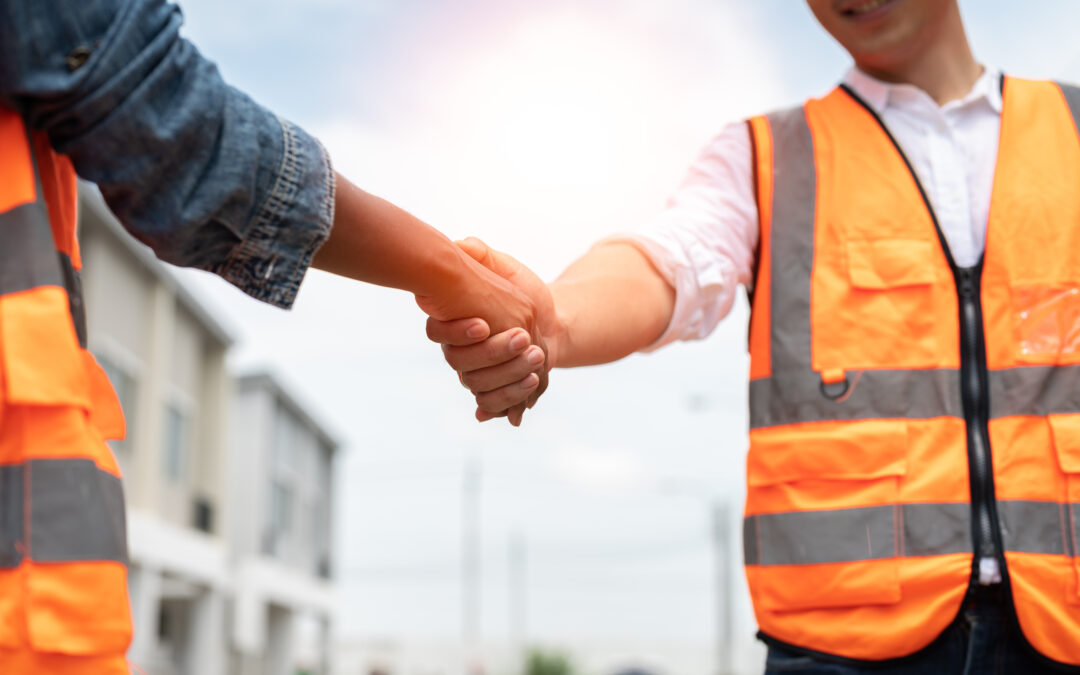 Contractor handshaking a client