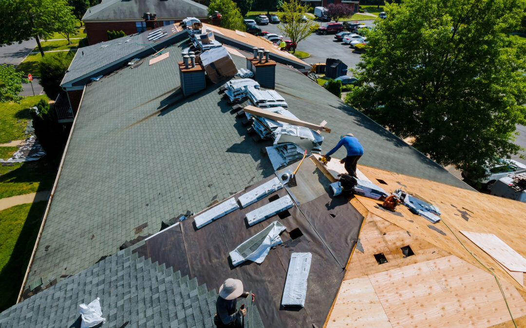 Construction worker on a renovation roof the house installed new shingles