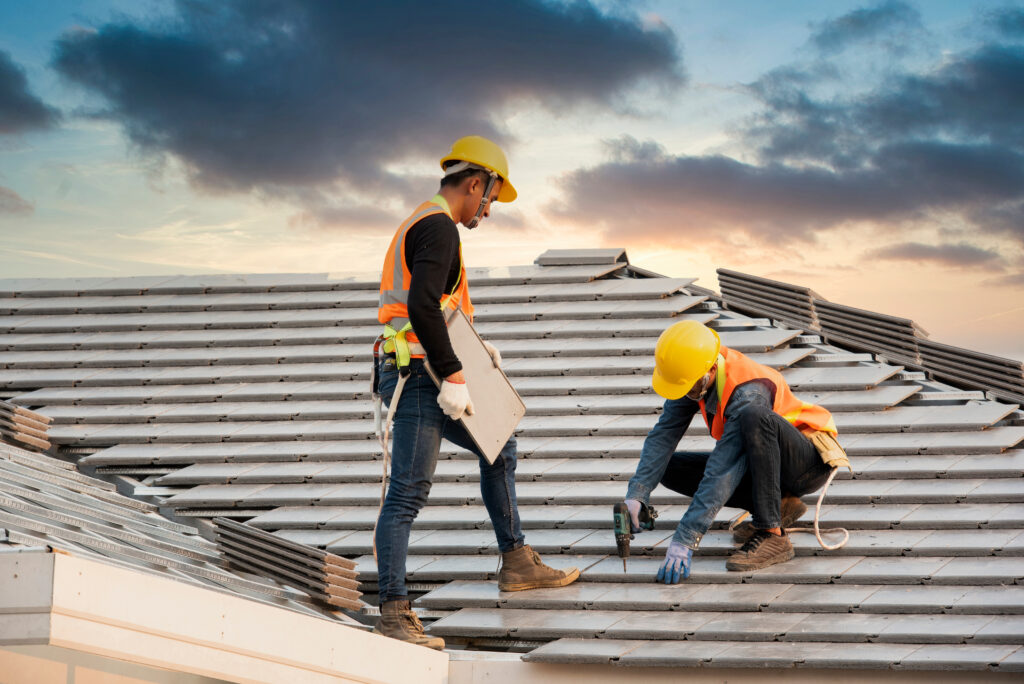 Engineer workers install new CPAC roof, roofing tools, electric drill, use on new roof with CPAC roof house construction idea.